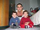 Twins with father in new Goztepe house.